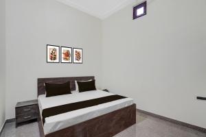 Postel nebo postele na pokoji v ubytování Hotel O Choudhary Hotel and Resort + 50 fotografií