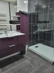a bathroom with a sink and a shower at Levogien in Hagécourt