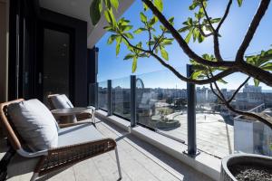 an apartment balcony with a view of the city at Green Hotel in Magong