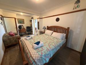 a bedroom with a bed with pillows on it at Cod Place in Beautiful South West Rocks in South West Rocks