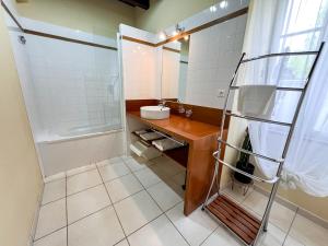 a bathroom with a sink and a shower at Gite Vert Maison Bretonne in Missillac +39 photos