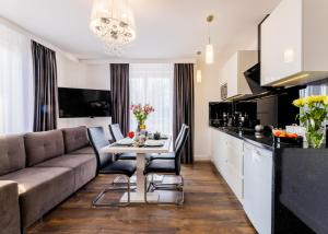 Μια τηλεόραση ή/και κέντρο ψυχαγωγίας στο Sunrise Apartaments
