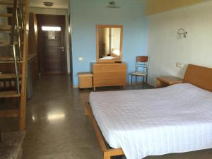 Postel nebo postele na pokoji v ubytování Hani Inn