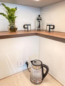 a tea kettle on a counter in a kitchen at Hygge Haven Saigon in Ho Chi Minh City
