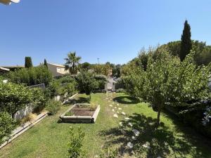 an overhead view of a garden with trees and grass at Villa de l'oustaoun in Sanary-sur-Mer