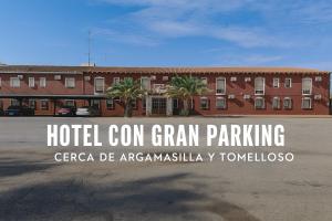 a hotel corn grain parking sign in front of a building at Hotel Peñarroya in Argamasilla de Alba