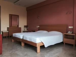Postel nebo postele na pokoji v ubytování Hani Inn