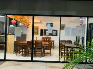 a dining room with a table and chairs in a room at Axis Pension Hotel in Mactan +64 photos