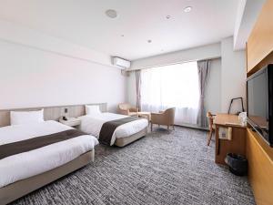 TV a/nebo společenská místnost v ubytování 湯宿くったり温泉 レイクイン