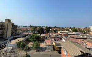 an overhead view of a city with buildings at The Fifth in Luanda
