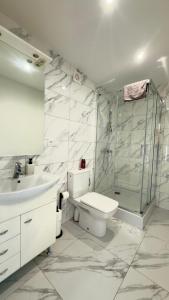 a bathroom with a shower and a toilet and a sink at MILITARY Guest Inn in Drawsko Pomorskie +61 photos