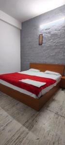 En eller flere senge i et værelse på Trilok inn