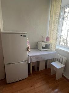 Kuchyň nebo kuchyňský kout v ubytování Трёхкомнатная квартира на Томпиева