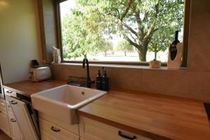 a kitchen with a sink and a window at Apartmán Farma Byzhradec in Dobruška +40 photos