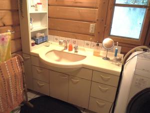 a bathroom with a sink and a mirror at Top Hill woman only accommodation in Wada +23 photos