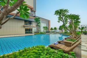 a swimming pool in front of a building at Four Points by Sheraton Bekasi in Bekasi