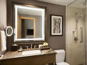 a bathroom with a sink and a mirror at Fairmont Jasper Park Lodge in Jasper
