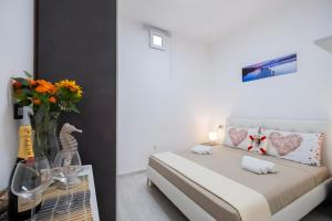 Postel nebo postele na pokoji v ubytování Mareluna Apartment