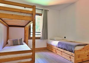 Ένα ή περισσότερα κρεβάτια σε δωμάτιο στο Combe –Spacieux appartement 4/6 personnes avec grand balcon +21 φωτογραφίες