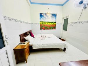 Postel nebo postele na pokoji v ubytování Queen Motel Vung Tau + 27 fotografií