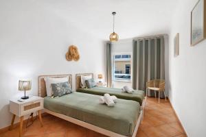 Ένα ή περισσότερα κρεβάτια σε δωμάτιο στο T2 Santa Luzia B +16 φωτογραφίες