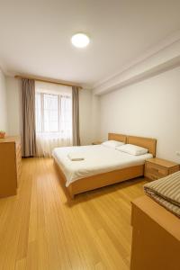 Ένα ή περισσότερα κρεβάτια σε δωμάτιο στο Yerevan Hotel