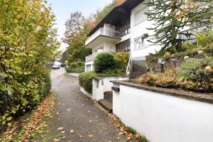 a street in front of a white building at Ferienwohnung Matteit in Bad Peterstal