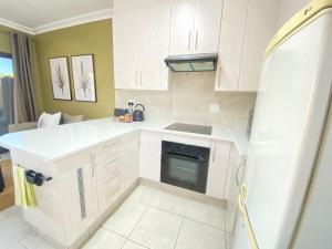 Kuchyň nebo kuchyňský kout v ubytování Aloe Hideaway