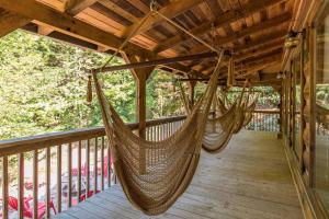 a porch with two hammocks on a deck at Hot Tub & WiFi - Big Boulder - Red River Gorge KY in Rogers