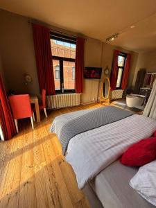 a bedroom with two beds and a bathroom with a sink at Maison du Rempart Guesthouse a 15-Min Walk from Bruges Centre in Bruges +35 photos