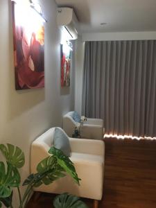 a living room with a couch and a window at M Villa in Bingin Beach +2 photos