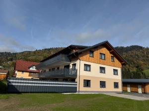 a large building with a fence in front of it at Ski und Wander Ferienwohnung Galsterberg-Blick Pruggern - Schladming-Dachstein in Pruggern