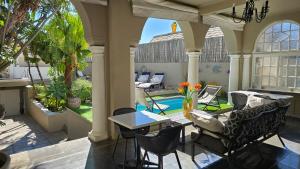 Χώρος καθιστικού στο Jardin d'ébène Boutique Guesthouse