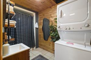 a kitchen with a stove and a sink in a room at Hot Tub & WiFi - Hillside Haven Red River Gorge KY in Rogers