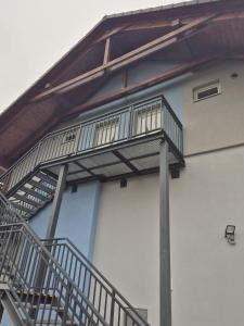 a spiral staircase on the side of a building at Apartmán By One in Banská Štiavnica