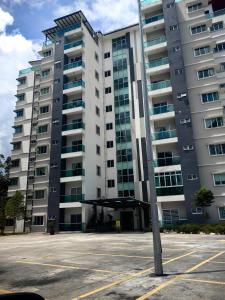 a parking lot in front of a large building at KAZ homestay in Tanah Rata