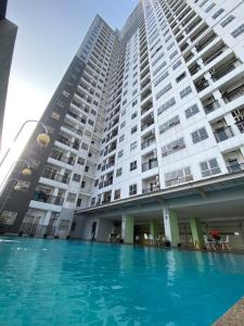a large building with a swimming pool in front of it at DN property in Bandung