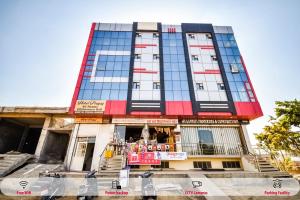 a building with a bar in front of it at Hotel O Prayag in Jaipur