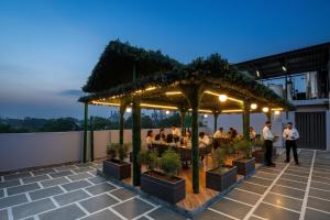 a restaurant on the roof of a building at HOTEL UPTOWN - Luxury Restaurant & Rooftop Near Connaught Place in New Delhi