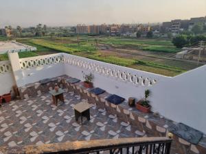 a balcony of a building with a table on it at Adream partment in Luxor in Luxor