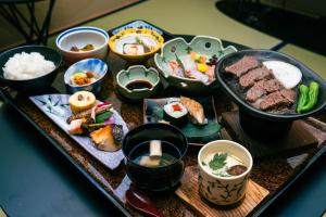 a tray of food with different types of food on it at Nazuna Kyoto Nishi Honganji in Kyoto
