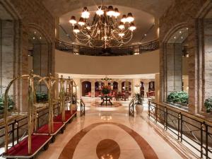 a large lobby with a chandelier in a building at Swissotel Lima in Lima