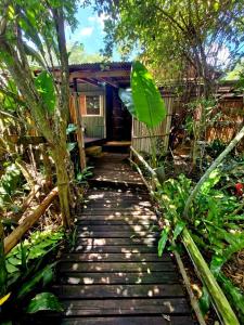a walkway leading to a house in the woods at Shengeza Lake Lodge in KuShengesa
