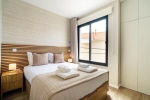 Ένα ή περισσότερα κρεβάτια σε δωμάτιο στο GuestRedy - A Modern Stay in Machico +22 φωτογραφίες