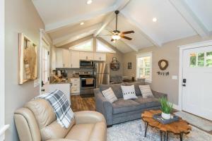 a living room with a couch and a table at WiFi & Waterfront - Soul Sister Red River Gorge KY in Rogers +30 photos