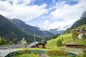 a village in a valley with mountains in the background at ZumSchutzpatron in Bschlabs