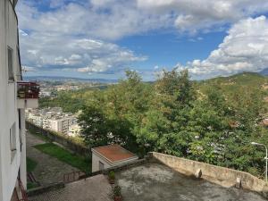 a view of a city from the balcony of a building at Up in Tirana Apartment in Tirana