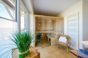 a room with a closet with a desk and a chair at Ferienhaus Auf der Ostsee in Kappeln +22 photos