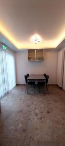 an empty room with a table and chairs in it at Holiday Home Villa Zonnebeke in Zonnebeke