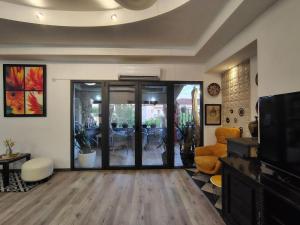 a living room with a sliding glass door at Katata Apartment Spacious House Floor with Terraces, 3 Bedrooms, Parking,Wi-Fi in Podgorica